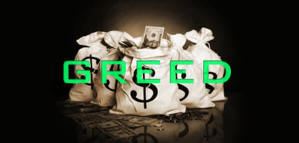 This is a photo of a bag of money. The bags have money signs on them and the photo has the word "GREED" written across from it.